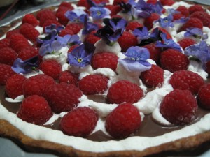 Raspberry Tart With purple pansies